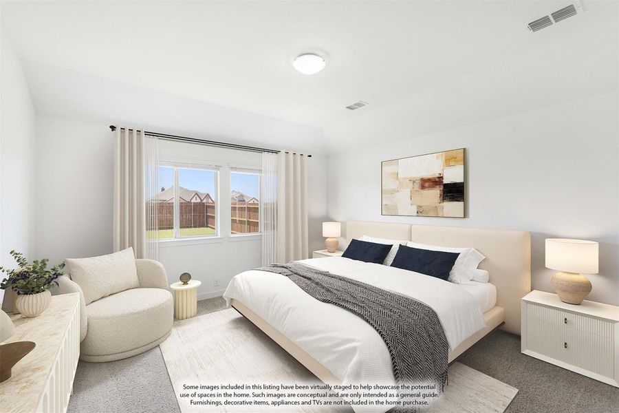 Bedroom with king-size bed, neutral carpet, sitting chair, and large window with backyard view