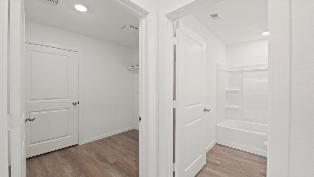 Representative unfurnished interior of a home built from the Estero by D.R. Horton in Lake Conroe Cove, Willis (Image 23). Representative unfurnished interior of a home built from the Estero by D.R. Horton in Lake Conroe Cove, Willis (Image 23).