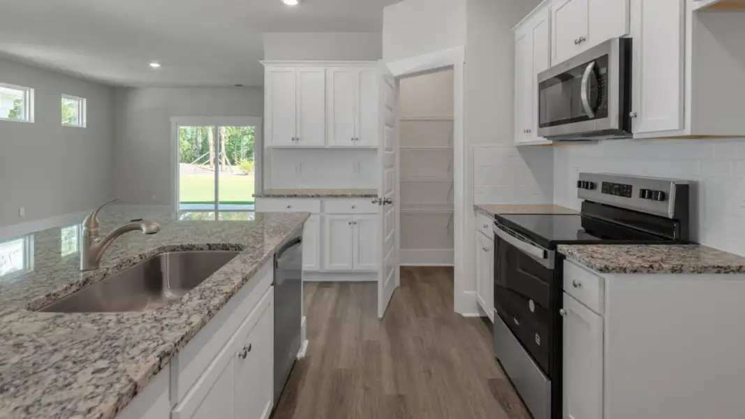 Furnished interior view inside a new home in The Retreat at Indigo Preserve Townhomes, Leland (Image 6).