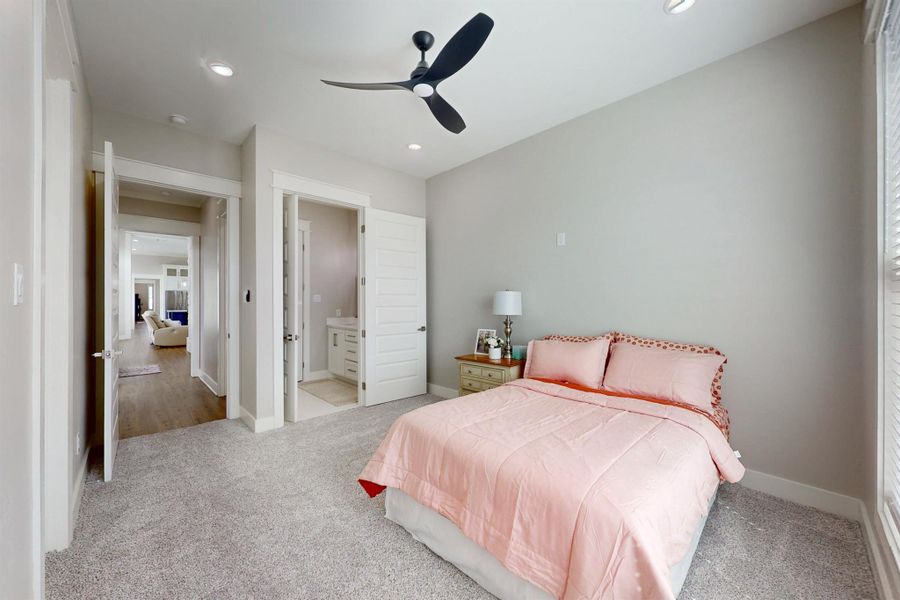 All bedrooms are generous in size. This Carpeted interior space has a ceiling fan, recessed lighting, and a window with blinds and a full bathroom