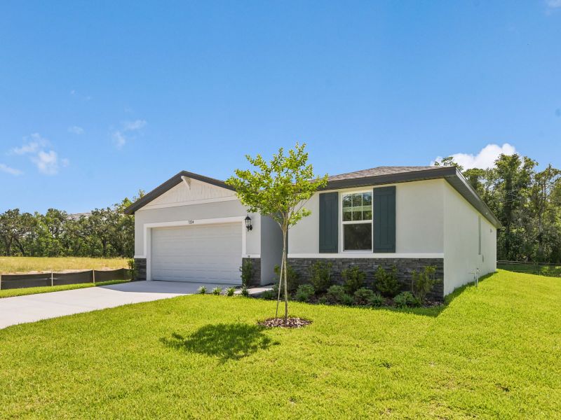 Front exterior of a new home in Leyland Preserve - Classic Series, Brooksville, FL, highlighting curb appeal (Image 2). Front exterior of a new home in Leyland Preserve - Classic Series, Brooksville, FL, highlighting curb appeal (Image 2).