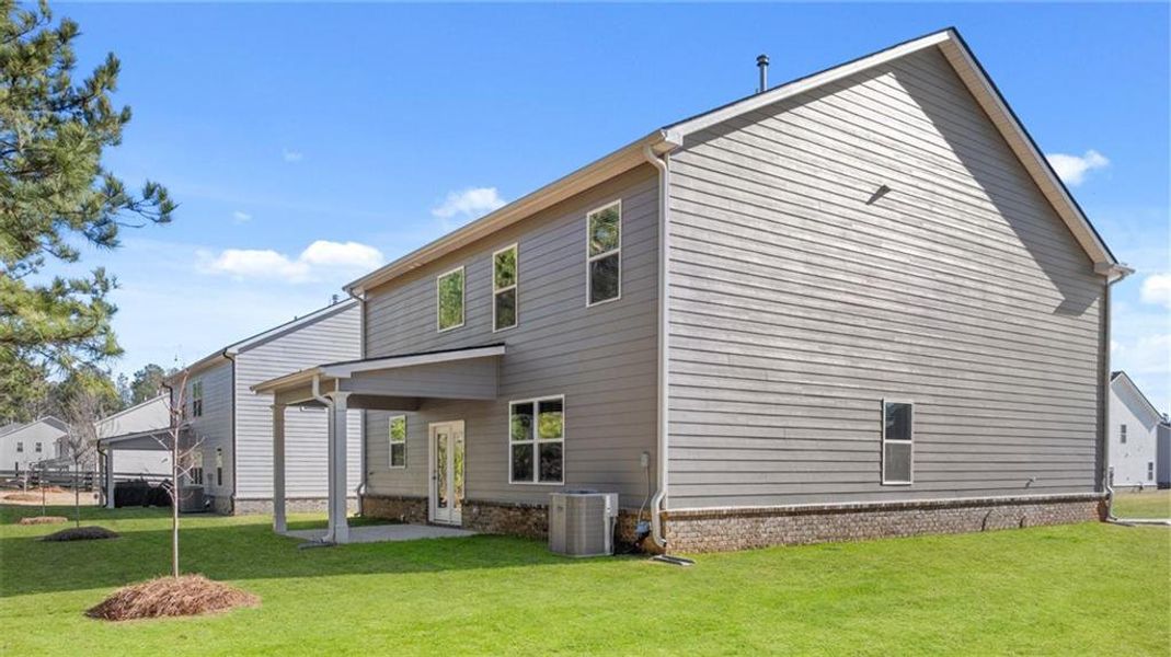 Exterior details and patio area of a home in Bridle Creek, Locust Grove (Image 3).