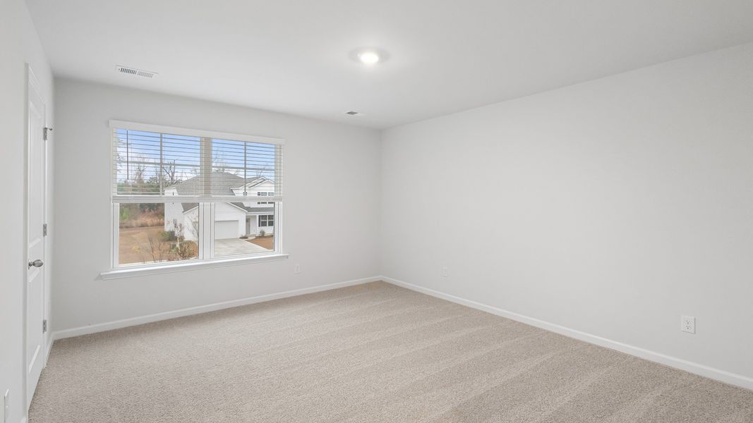 Spacious, unfurnished interior of a new home in Pine Hills at Cane Bay, Summerville (Image 15).