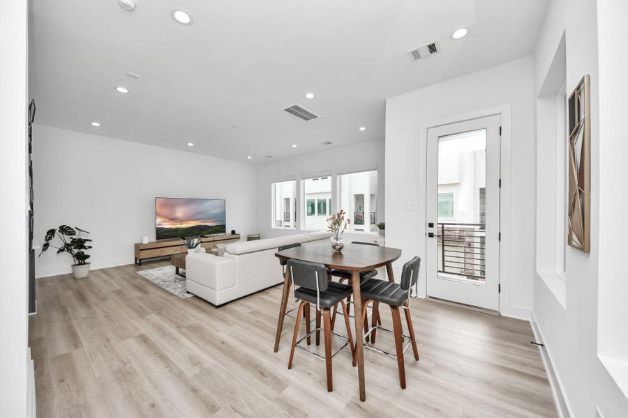 Step into the second level where you're greeted with a spacious living and dining area. Step into the second level where you're greeted with a spacious living and dining area.