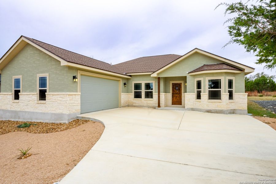 Front exterior of a new home in , Blanco, TX, highlighting curb appeal (Image 2). Front exterior of a new home in , Blanco, TX, highlighting curb appeal (Image 2).
