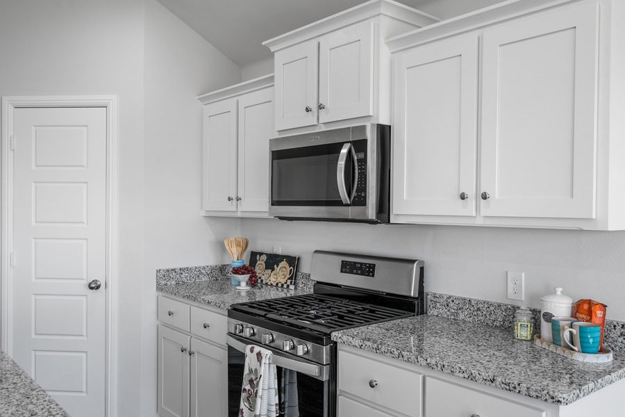 Representative furnished interior of a home built from the BELLVUE by D.R. Horton in Faculty Row, Abilene (Image 12).
