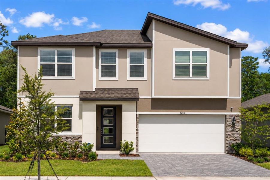 Front exterior of a new home in Meridian Parks, Orlando, FL, highlighting curb appeal (Image 24). Front exterior of a new home in Meridian Parks, Orlando, FL, highlighting curb appeal (Image 24).