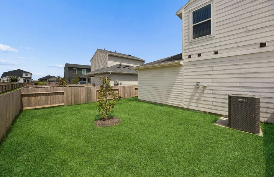 Exterior details and patio area of a home in The Courtyards at Stokesbury, Waller (Image 17).