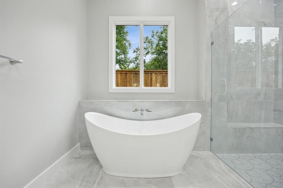 Gorgeous Soaking Tub with Brizo Faucet Trim; Pella Windows