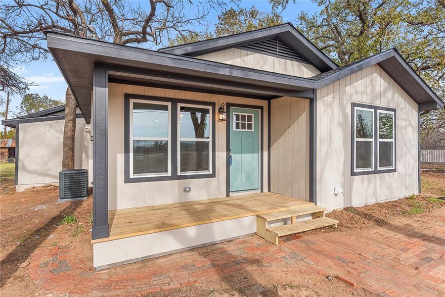Entrance to property with a wooden deck