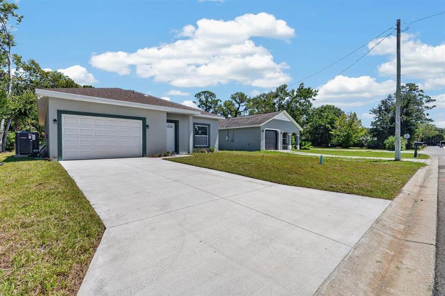 Front exterior of a new home in , Daytona Beach, FL, highlighting curb appeal (Image 2). Front exterior of a new home in , Daytona Beach, FL, highlighting curb appeal (Image 2).
