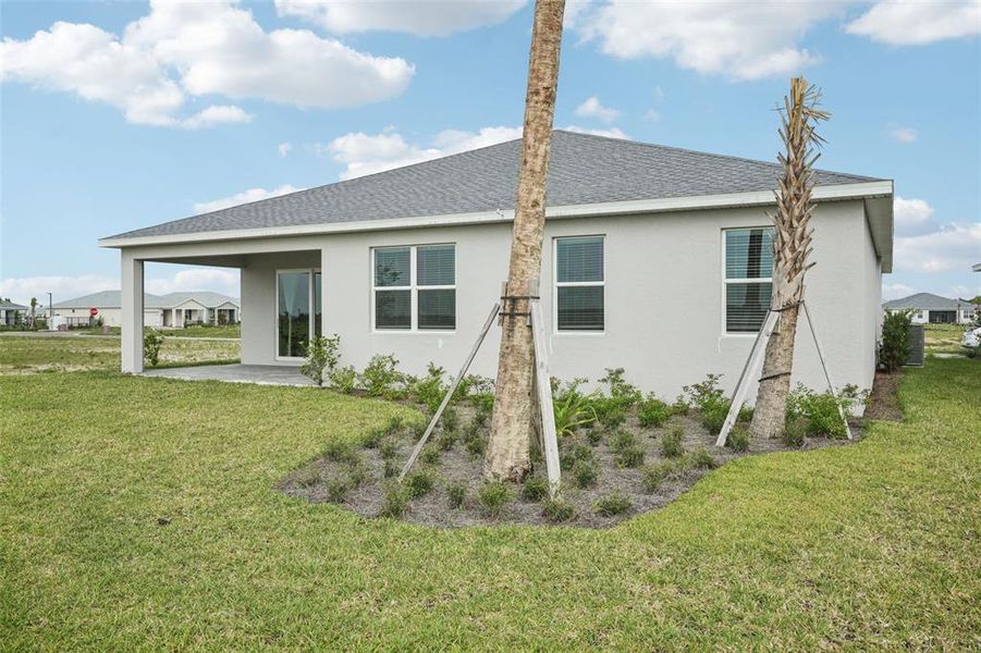 Exterior details and patio area of a home in Crescent Lakes - Signature Series, Punta Gorda (Image 3).