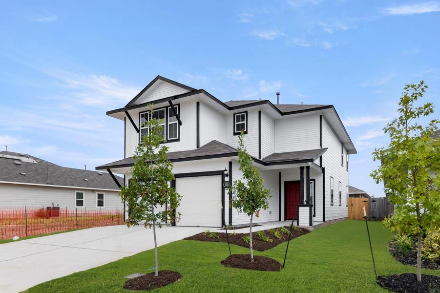 Front exterior of a new home in Hymeadow, Maxwell, TX, highlighting curb appeal (Image 21).