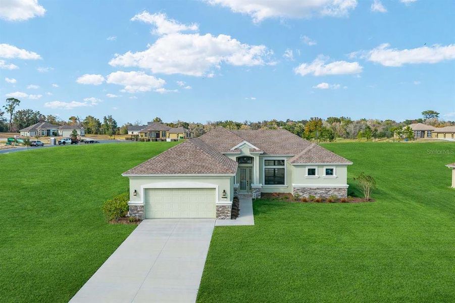 Front exterior of a new home in , Inverness, FL, highlighting curb appeal (Image 21).