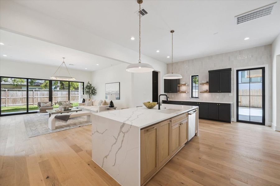 Accent White Oak cabinets at center island with complementing paint grade cabinet surround. Accent White Oak cabinets at center island with complementing paint grade cabinet surround.