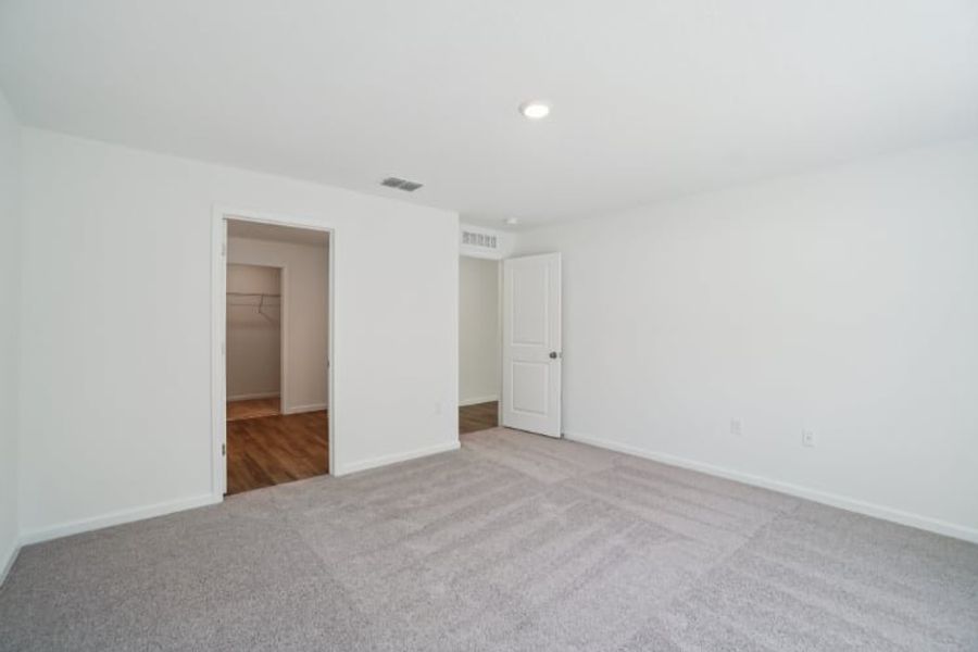 A hallway with white walls.