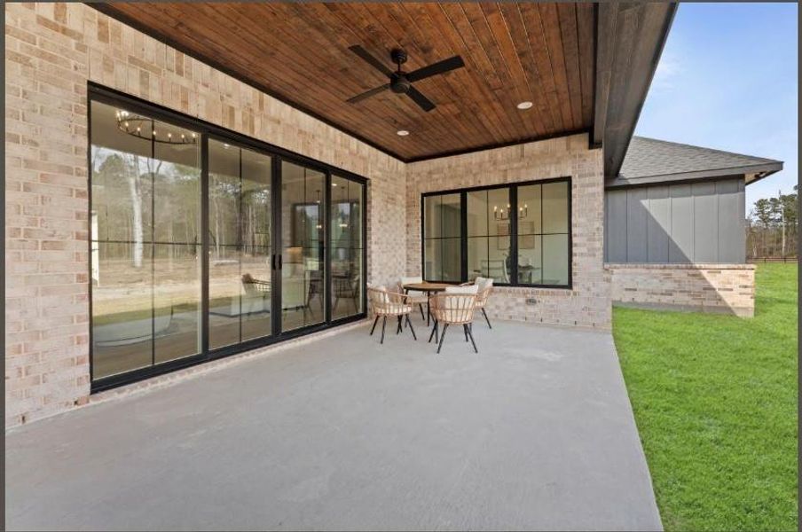 Exterior details and patio area of a home in , Conroe (Image 4).