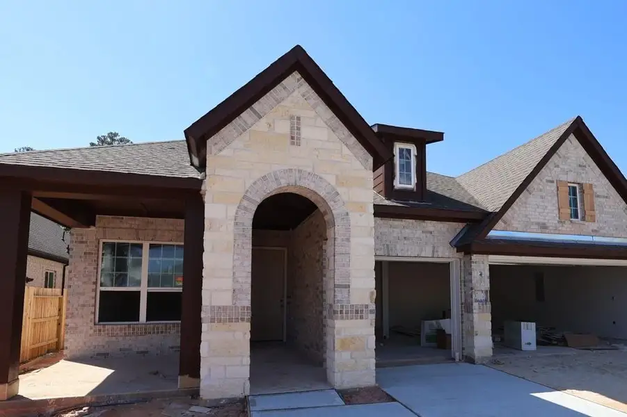 Exterior details and patio area of a home in Grand Central Park 55' Homesites, Conroe (Image 3).