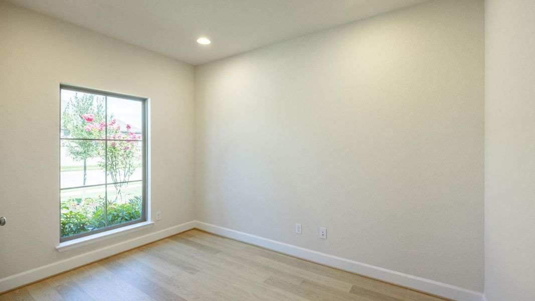 Unfurnished room with light wood finished floors and recessed lighting