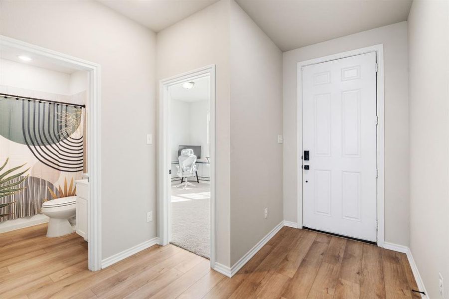 Foyer featuring light wood finished floors Foyer featuring light wood finished floors