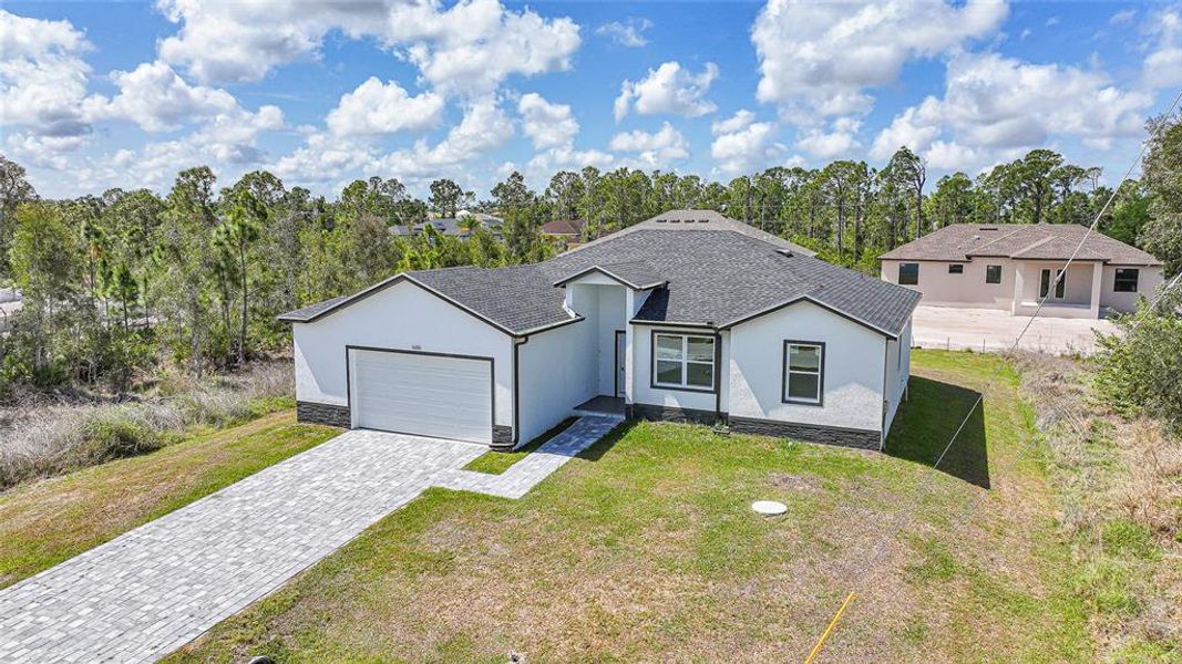 Front exterior of a new home in , Port Charlotte, FL, highlighting curb appeal (Image 29).