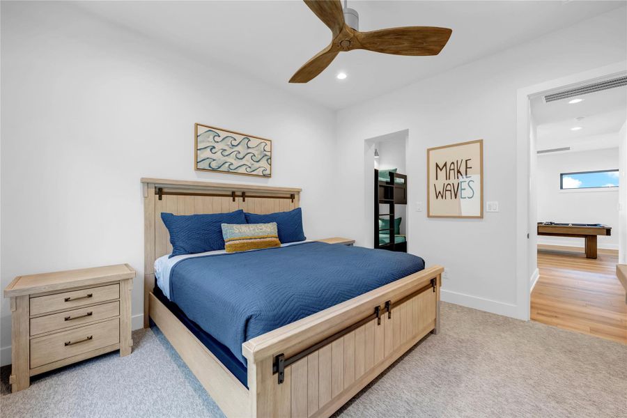 Bedroom five: High ceilings and soft carpet floor create a serene setting in this airy bedroom.