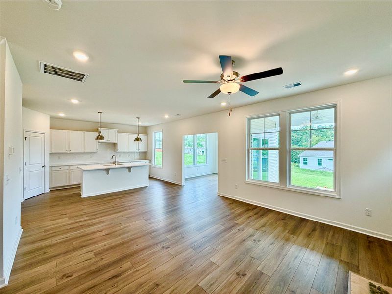 Gleaming hardwood floors and a modern open floorpl
