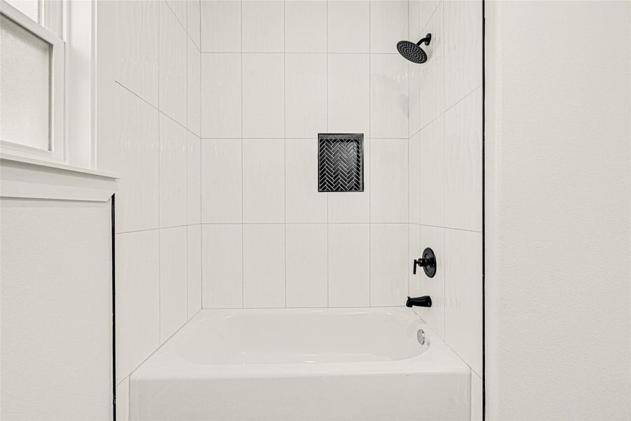 Shower/tub combo in second bath Shower/tub combo in second bath