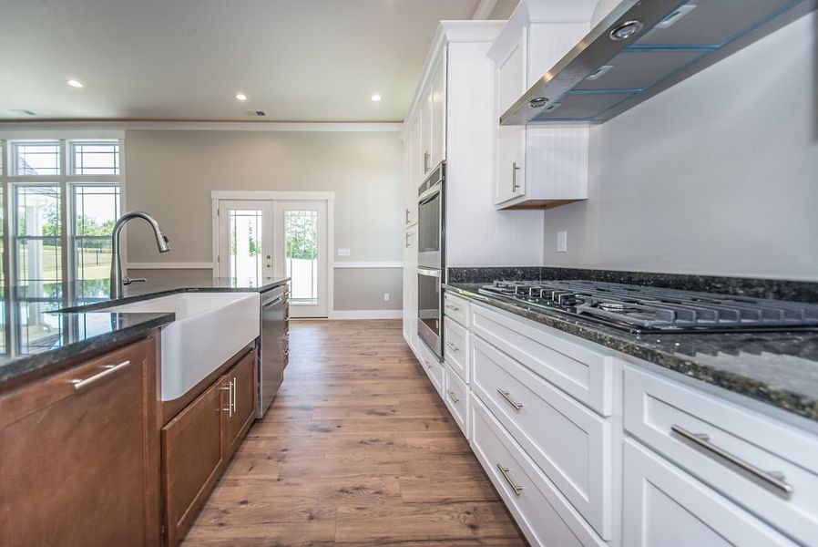 Representative furnished interior of a home built from the Beaumont Elite by Enchanted Homes in Pointe Summit, Slater-Marietta (Image 9).
