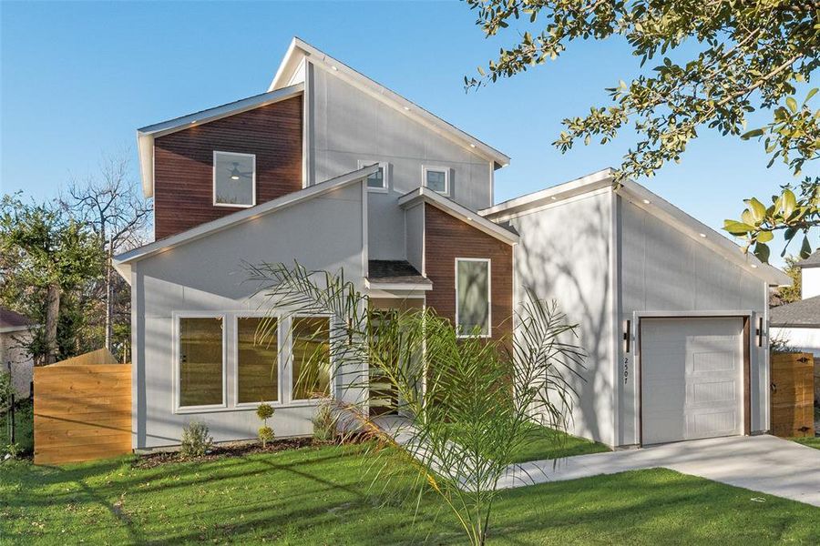 View of front of property featuring an attached garage and concrete driveway View of front of property featuring an attached garage and concrete driveway