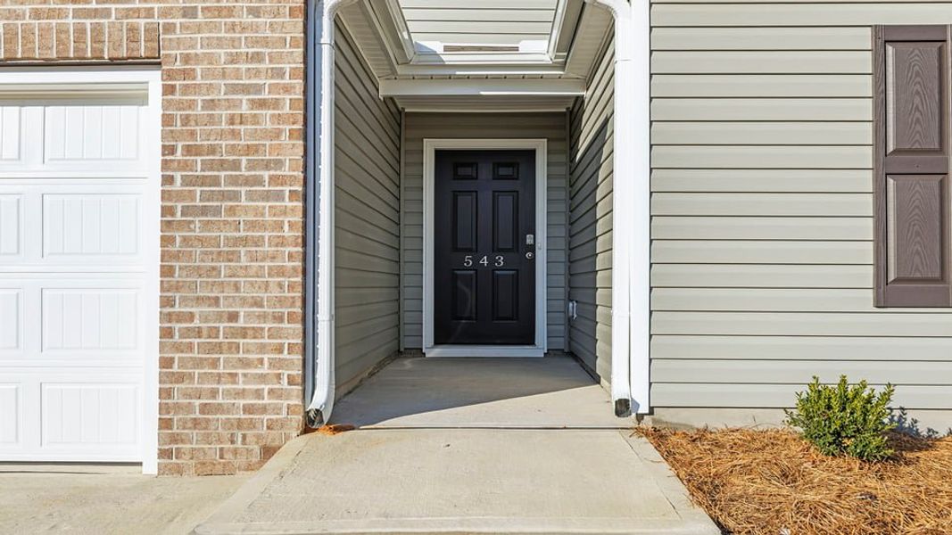 Exterior details and patio area of a home in Lakestone, Woodruff (Image 2).