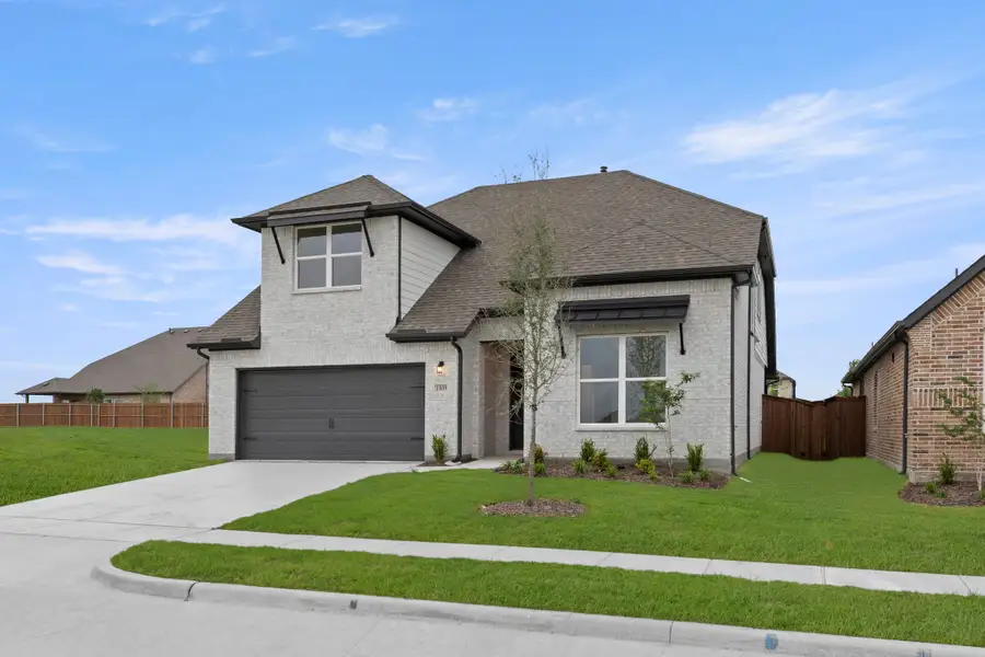 Representative exterior photo of a completed home built from the Honor by Rockwell Homes in Creekside, Royse City, TX (Image 31).