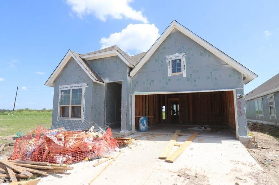 Front exterior of a new home in Meridiana 45' Homesites, Manvel, TX, highlighting curb appeal (Image 2). Front exterior of a new home in Meridiana 45' Homesites, Manvel, TX, highlighting curb appeal (Image 2).