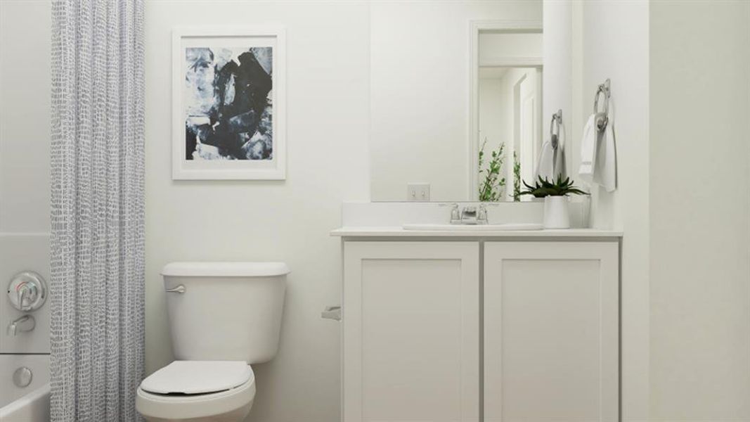 Full bathroom with shower / bath combination with curtain, vanity, and toilet