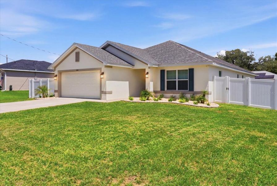 Front exterior of a new home in Orange Blossom Hills, Summerfield, FL, highlighting curb appeal (Image 2). Front exterior of a new home in Orange Blossom Hills, Summerfield, FL, highlighting curb appeal (Image 2).