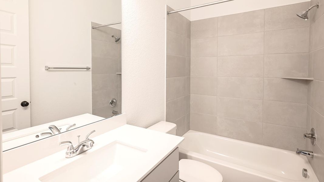 Bathroom featuring shower / bath combination and vanity Bathroom featuring shower / bath combination and vanity