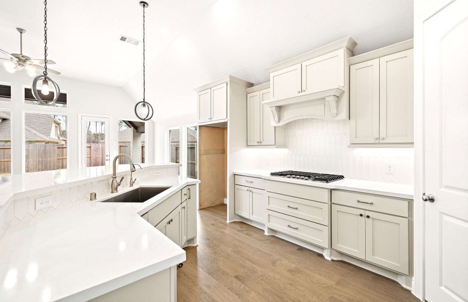 Representative furnished interior of a home built from the 2406 by Ravenna Homes in The Highlands 55′, Porter (Image 12).