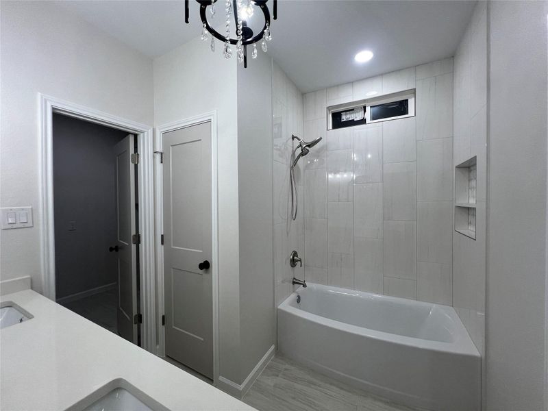 Primary bath with private toilet room.