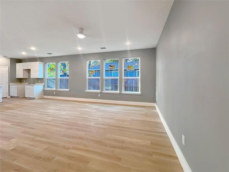 Unfurnished living room with light hardwood / wood-style floors