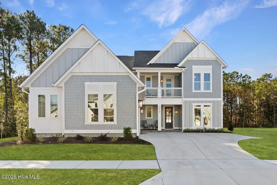 Front exterior of a new home in East & Mason, Wilmington, NC, highlighting curb appeal (Image 1). Front exterior of a new home in East & Mason, Wilmington, NC, highlighting curb appeal (Image 1).