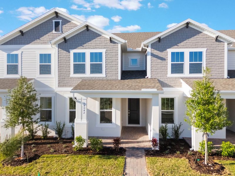 Representative exterior photo of a completed home built from the Edison by Rockwell Homes in Harvest at Ovation - Townhomes, Winter Garden, FL (Image 2). Representative exterior photo of a completed home built from the Edison by Rockwell Homes in Harvest at Ovation - Townhomes, Winter Garden, FL (Image 2).