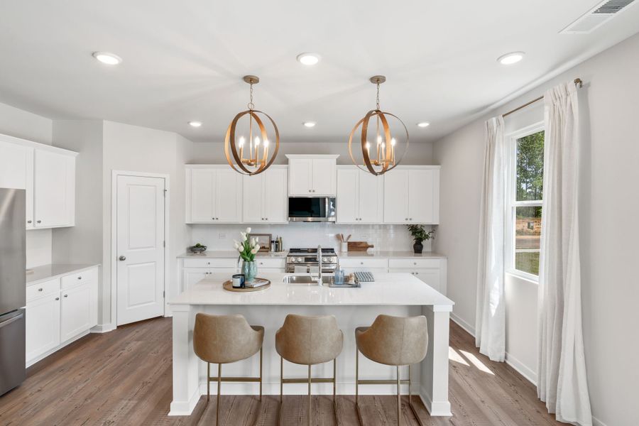 A kitchen with white cabinets. A kitchen with white cabinets.