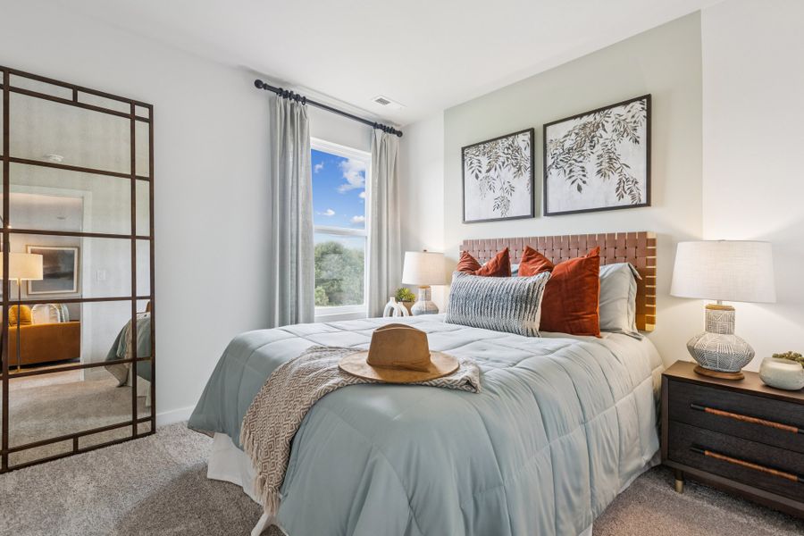 A bedroom with a large bed. A bedroom with a large bed.