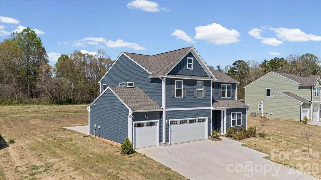 Front exterior of a new home in , Statesville, NC, highlighting curb appeal (Image 2). Front exterior of a new home in , Statesville, NC, highlighting curb appeal (Image 2).