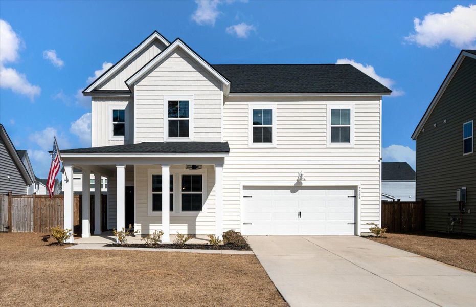 Front exterior of a new home in Sweetgrass at Summers Corner, Summerville, SC, highlighting curb appeal (Image 28).
