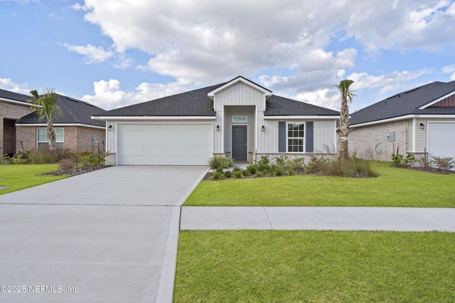 Front exterior of a new home in Shadow Crest at Rolling Hills, Green Cove Springs, FL, highlighting curb appeal (Image 16).