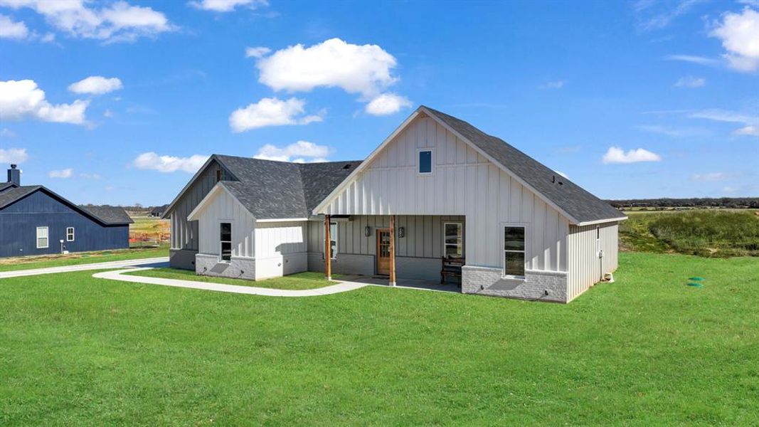 Exterior details and patio area of a home in Parallel Pastures, Poolville (Image 3).