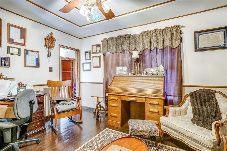 Office featuring wood finished floors, a ceiling fan, and crown molding Office featuring wood finished floors, a ceiling fan, and crown molding