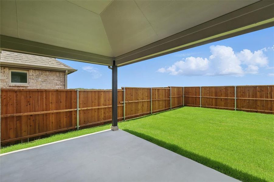 Fenced backyard featuring a patio Fenced backyard featuring a patio