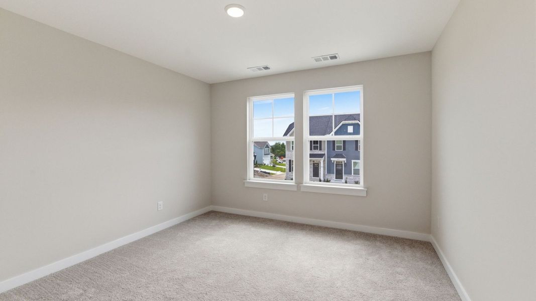 Bedroom with carpet and windows Bedroom with carpet and windows